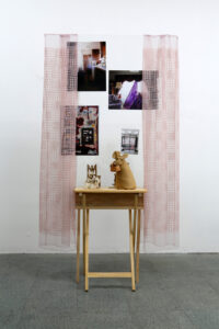 Rochele Gomez, Vision Board (clothes pin chairs), 2023. Glass, wood, tv tray, found objects, tape, digital inkjet prints on archival paper, 69" × 37 12" x 12".